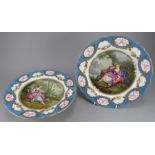 A 19th Century Sevres dessert tazza and matching plate, each painted with a central scene of a young