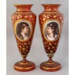 A pair of mid 19th Century European ruby glass baluster vases, circa 1870, applied oval opaque glass