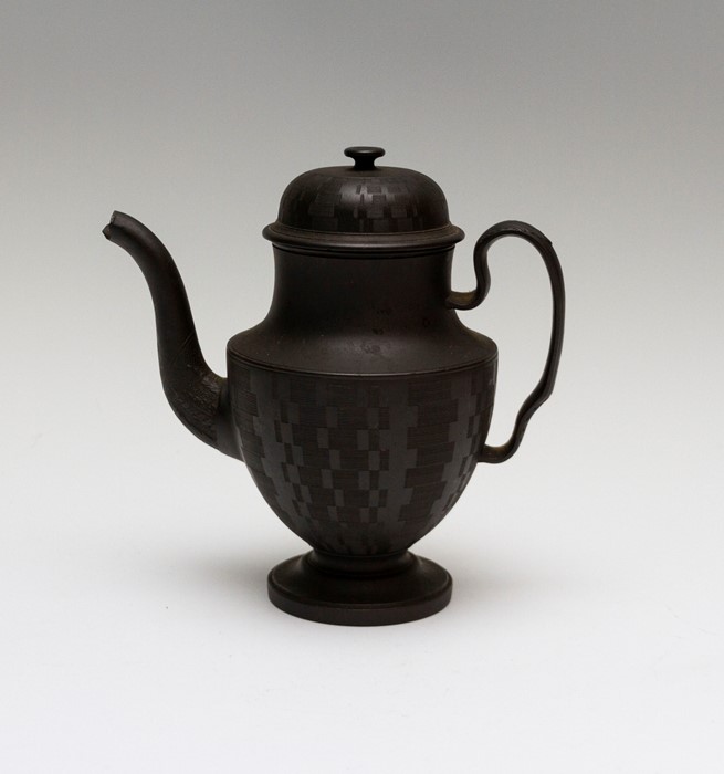 An early nineteenth century black basalt coffeepot and cover, possibly Spode circa 1810-20. It has