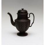 An early nineteenth century black basalt coffeepot and cover, possibly Spode circa 1810-20. It has