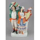 A late nineteenth century Staffordshire very large figure group, c. 1860-70. It depicts two