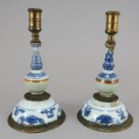 A pair of Chinese hand-painted porcelain taper assembled from various ceramic components (18th C),