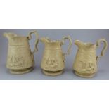 A set of three early nineteenth century relief moulded yellow stoneware jugs by Jones and Walley, c.