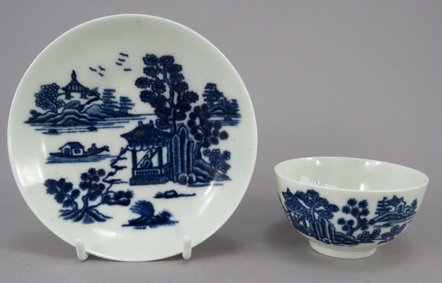 An eighteenth century blue and white transfer-printed porcelain Worcester tea bowl and saucer, c.