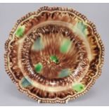 An eighteenth century Wheildon ware soup dish, c. 1760-80. It is decorated in browns, greens and has