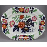 An early nineteenth century blue and white transfer-printed and coloured platter, c. 1820. It is