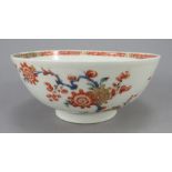 An eighteenth century Bow porcelain waste bowl, c. 1765. It is hand-painted in reds, blues and