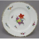 An early nineteenth century Copenhagen porcelain plate, c.1820. It is decorated with various