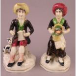 A pair of mid-nineteenth century Staffordshire figures, c. 1840. They depict a seated couple, one