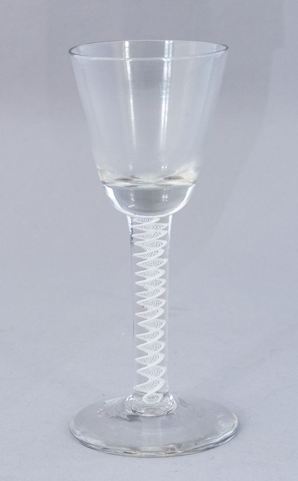 An 18th Century wine glass, circa 1770, conical bowl, double opaque twist stem, broken pontil,