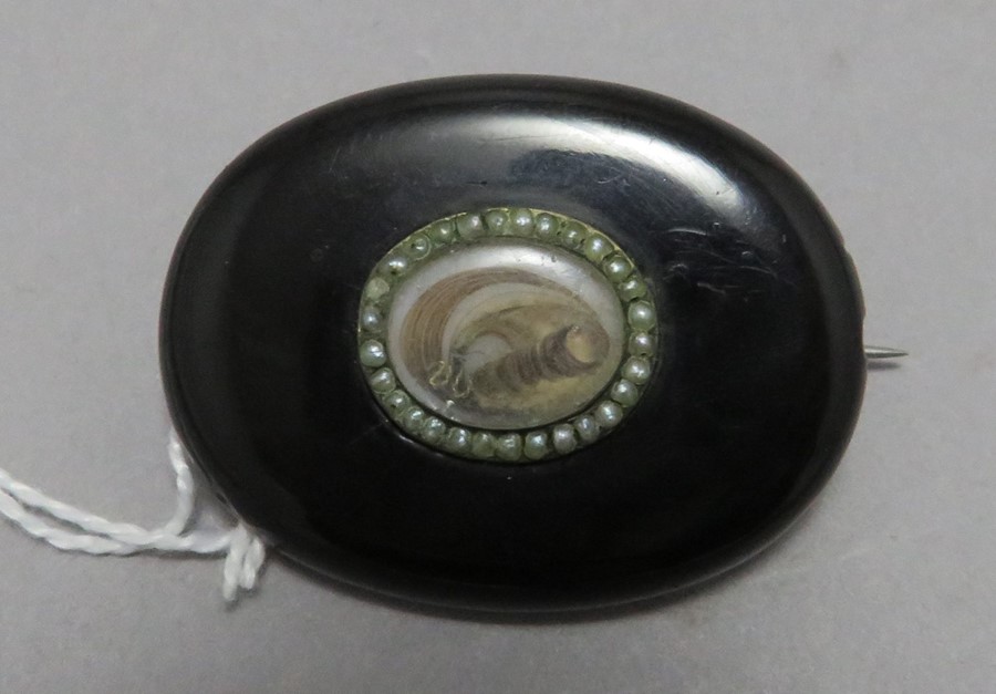 A late Georgian, early Victorian oval Whitby jet m