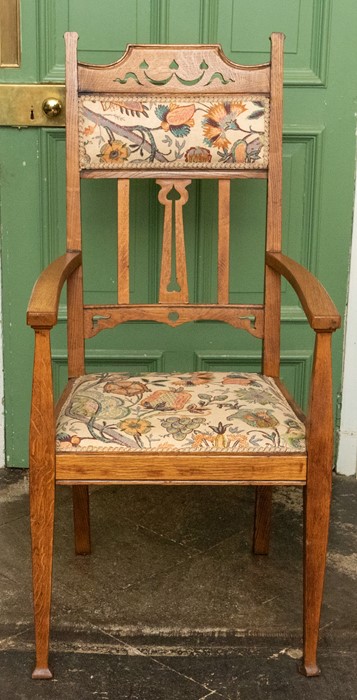 An Arts & Crafts light oak carver armchair, circa