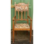 An Arts & Crafts light oak carver armchair, circa