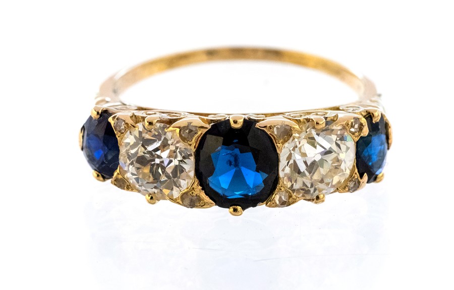 A Victorian style five stone diamond and sapphire