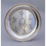 An Elizabeth II silver waiter, engraved with chara