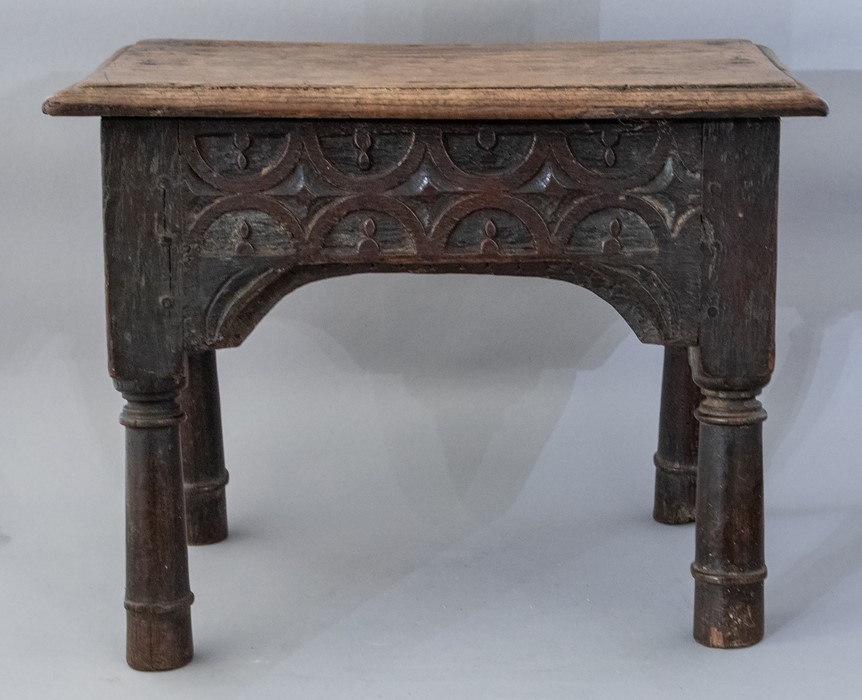 A 17th Century oak joint stool, plank top, lunette