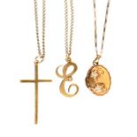 A 9ct crucifix, 9ct E pendant and a locket all on