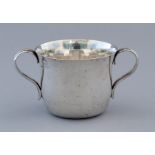 An Edward VII silver two handled porringer, reeded