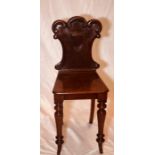 A late George III mahogany hall chair, circa 1820,