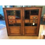 An Edwardian oak smokers cabinet, double glazed do