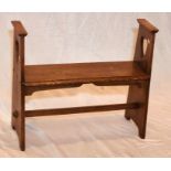 An Arts & Crafts oak open bench seat, two pierced