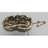 A Victorian garnet brooch with gilt metal. 5 cm lo