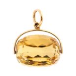 A 9ct gold mounted faceted topaz swivel fob, the t