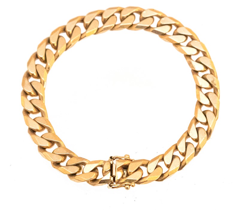 A 9ct heavy yellow gold flat curb link bracelet