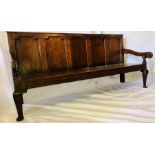 An early George III  oak five panel settle, Circa