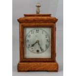 An Edwardian oak cased bracket timepiece, caddy to