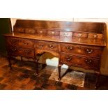 A George III regional oak standing dresser, circa