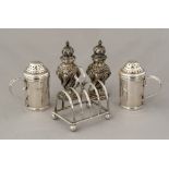 A pair of Edwardian ring handled pepper shakers, m