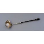 A Georgian silver punch ladle, serpentine shaped b