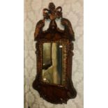 A Queen Anne period walnut and giltwood wall mirro