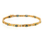 A 9ct yellow gold bracelet set twelve oval cut sap