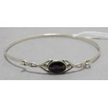 A contemporary silver bangle with Blue John in the