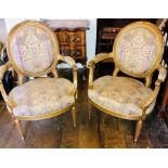 A Louis XVI revival giltwood three piece salon suite, comprising two seater sofa, two armchairs, all