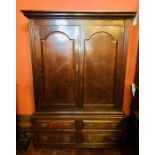 A mid 18th Century George II/III oak livery cupboard, circa 1760, moulded cornice over two arch