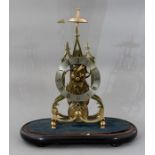 A traditional brass skeleton clock, triple spire d