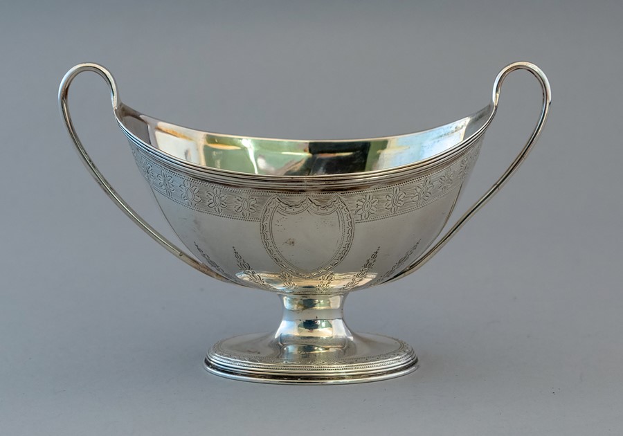 A George III silver boat shaped twin handled sucri