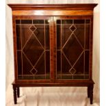 An Edwardian mahogany strung vitrine bookcase, mou