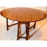 A George I oak dropleaf table, circa 1730, rectang