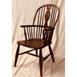 A 19th Century elm and ash Windsor elbow chair, ci