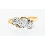 A three stone diamond ring, 18ct and platinum, wit