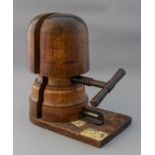 A vintage milliner's treen hat stretcher with ivor