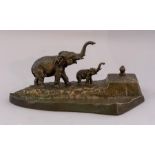 An early 20th Century bronzed metal pen stand, sur