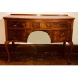 A George III revival mahogany bow front sideboard,