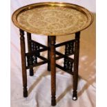 A large Egyptian brass tray top table, decorated engraving, folding hardwood mother of pearl inlay