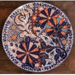 A large Japanese imari circular charger, late 19th Century, extensively decorated with fan design,