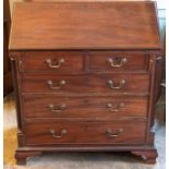 A George III mahogany bureau, circa 1760, in the manner of Thomas Chippendale, fall front